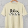 Kaos Snoopy The Beagles Band – Parodi The Beatles Lucu & Nostalgia | Kaos Musik Pop Culture | T-shirt Distro Unisex Pria Wanita Baju Lengan Pendek Bahan Katun - DJAVASTREET - Gambar 5